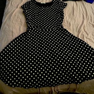 Tight fitting black polka dot flare vintage dress
